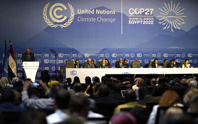 Sameh Shoukry, president of the COP27 climate summit, left speaks during an opening session at the COP27 UN Climate Summit, November 6, 2022, in Sharm el-Sheikh, Egypt. (AP Photo/Peter Dejong)
