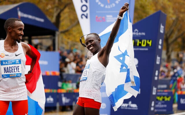 Women's division second place finisher Lonah Chemtai Salpeter, of Israel, reacts at the finish line of the New York City Marathon, November 6, 2022, in New York. (AP Photo/Jason DeCrow) Women's division second place finisher Lonah Chemtai Salpeter, of Israel, reacts at the finish line of the New York City Marathon, November 6, 2022, in New York. (AP Photo/Jason DeCrow)
