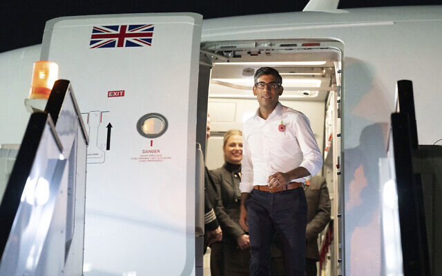 Britain's Prime Minister Rishi Sunak arrives in Sharm el-Sheikh, Egypt, to attend the COP27 Climate Summit, November 6, 2022. (Stefan Rousseau/Pool Photo via AP) Britain's Prime Minister Rishi Sunak arrives in Sharm el-Sheikh, Egypt, to attend the COP27 Climate Summit, November 6, 2022. (Stefan Rousseau/Pool Photo via AP)