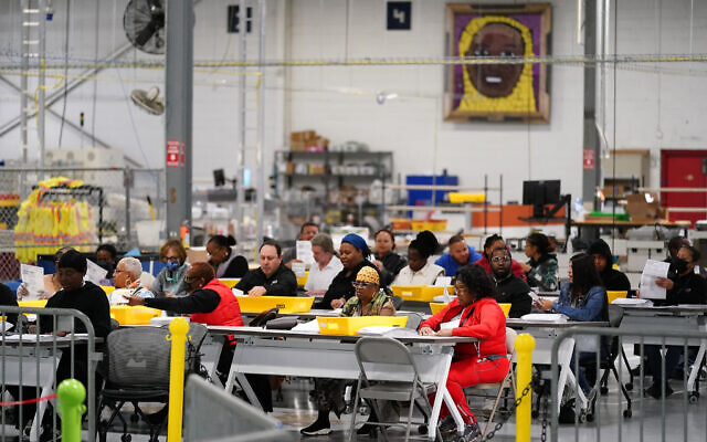Election workers process mail-in-ballots for the US midterm elections in Philadelphia, November 8, 2022. (AP Photo/Matt Rourke)