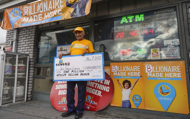 Business owner Joe Chahayed holds a check outside Joe's Service Center in Altadena, northeast of Los Angeles Nov. 8, 2022. For selling the winning ticket, (AP Photo/Damian Dovarganes) Business owner Joe Chahayed holds a check outside Joe's Service Center in Altadena, northeast of Los Angeles Nov. 8, 2022. For selling the winning ticket, (AP Photo/Damian Dovarganes)