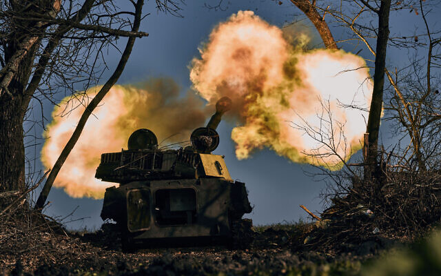 A self-propelled artillery vehicle fires near Bakhmut, Donetsk region, Ukraine, Wednesday, Nov. 9, 2022. (AP Photo/LIBKOS) A self-propelled artillery vehicle fires near Bakhmut, Donetsk region, Ukraine, Wednesday, Nov. 9, 2022. (AP Photo/LIBKOS)