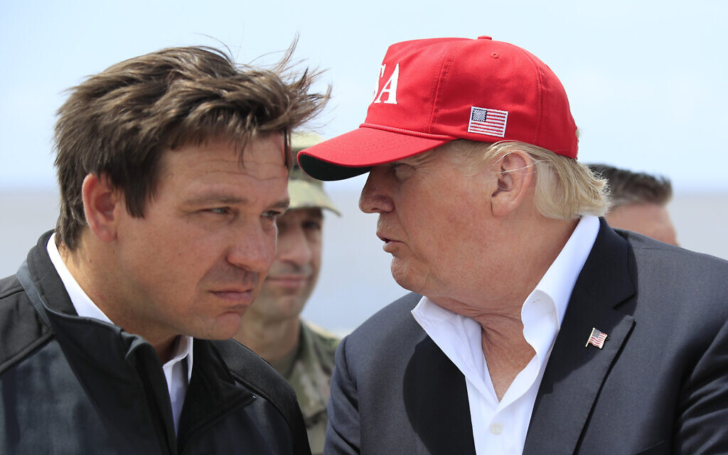 File: US President Donald Trump talks to Florida Governor Ron DeSantis, left, during a visit to Lake Okeechobee and Herbert Hoover Dike at Canal Point, Florida, March 29, 2019. (AP Photo/Manuel Balce Ceneta, File) File: US President Donald Trump talks to Florida Governor Ron DeSantis, left, during a visit to Lake Okeechobee and Herbert Hoover Dike at Canal Point, Florida, March 29, 2019. (AP Photo/Manuel Balce Ceneta, File)
