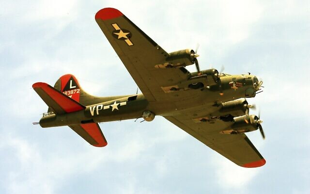 File: The historic US military B-17 aircraft named "Texas Raiders" flies over Barksdale A.F.B., Louisiana, on May 8, 2021. On November 12, 2022, the plane collided with another during the Commemorative Air Force Wings Over Dallas air show. (AP Photo/Dr. Scott M. Lieberman)