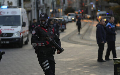 Security and ambulances at the scene after an explosion on Istanbul's popular pedestrian Istiklal Avenue, Sunday, Nov. 13, 2022. (AP /Francisco Seco)