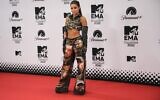 Noa Kirel poses for photographers at the European MTV Awards 2022 in Dusseldorf, Germany, November 13, 2022. (AP Photo/ Martin Meissner)