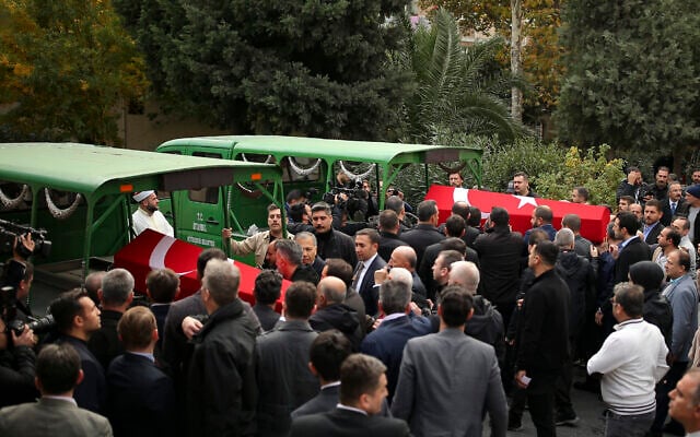 Relatives and friends of Arzu Ozsoy and her 15-year-old daughter Yagmur Ucar, who died in Sunday's explosion occurred on Istiklal avenue, attend their funeral in Istanbul, Turkey, November 14, 2022. (AP Photo/Emrah Gurel)