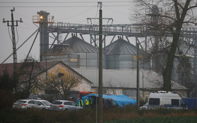 Police officers work outside a grain depot where, according to the Polish government, an explosion of a Russian-made missile killed two people in Przewodow, Poland, Nov. 16, 2022. (AP Photo/Michal Dyjuk) Police officers work outside a grain depot where, according to the Polish government, an explosion of a Russian-made missile killed two people in Przewodow, Poland, Nov. 16, 2022. (AP Photo/Michal Dyjuk)