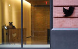 A receptionist works in the lobby of the building that houses the Twitter office in New York, Oct. 26, 2022. (AP Photo/Mary Altaffer, File)