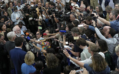 Members of the media listen as Frans Timmermans, executive vice president of the European Commission, left, speaks at the COP27 UN Climate Summit, November 19, 2022, in Sharm el-Sheikh, Egypt. (AP Photo/Peter Dejong)