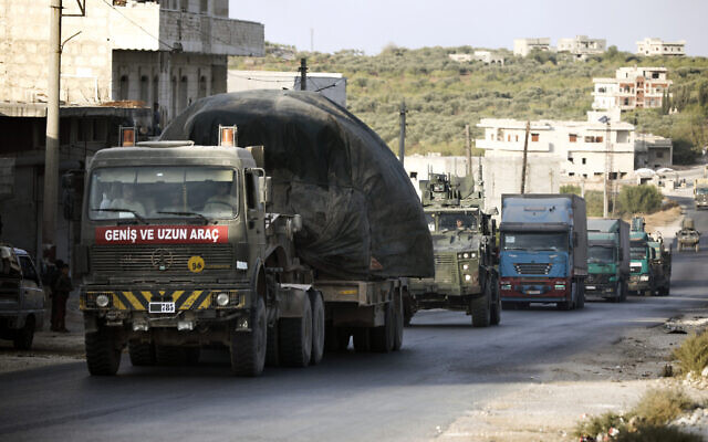 Illustrative: Turkish military convoy drives through the village of Urum al-Jawz, in Idlib province, Syria, Oct. 20, 2020. (AP Photo/Ghaith Alsayed, File) Illustrative: Turkish military convoy drives through the village of Urum al-Jawz, in Idlib province, Syria, Oct. 20, 2020. (AP Photo/Ghaith Alsayed, File)