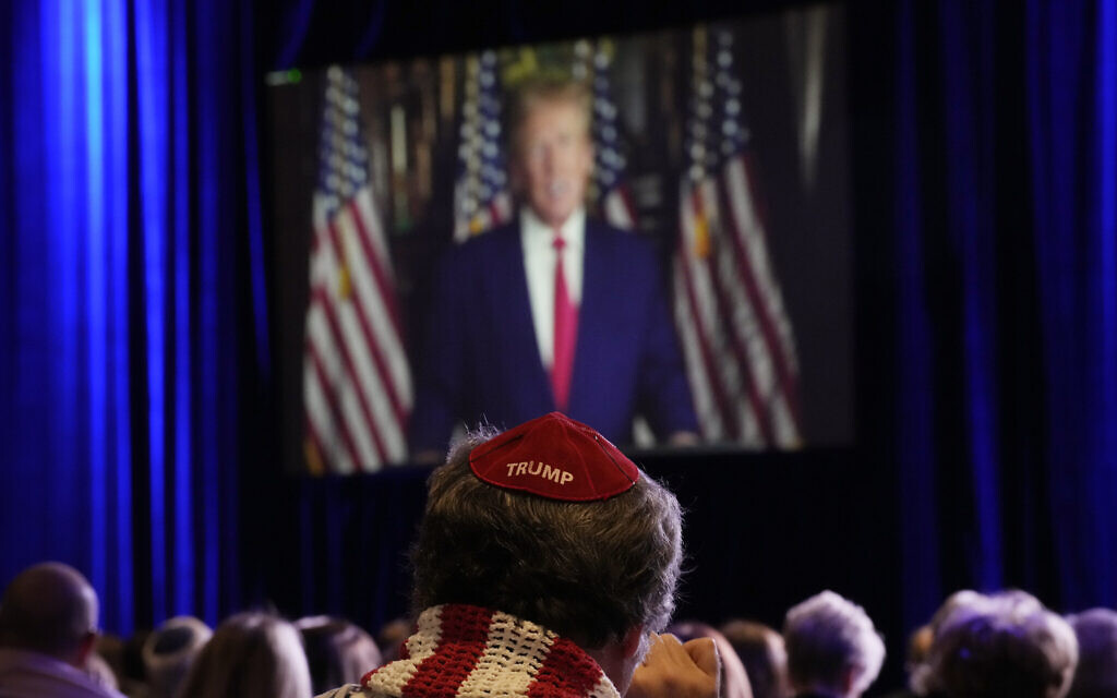 People listen as former president Donald Trump speaks remotely to an annual leadership meeting of the Republican Jewish Coalition, November 19, 2022, in Las Vegas. (AP Photo/John Locher) People listen as former president Donald Trump speaks remotely to an annual leadership meeting of the Republican Jewish Coalition, November 19, 2022, in Las Vegas. (AP Photo/John Locher)