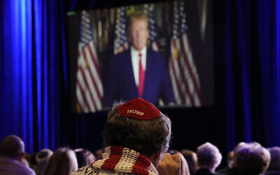 People listen as former US President Donald Trump speaks remotely to an annual leadership meeting of the Republican Jewish Coalition November 19, 2022, in Las Vegas. (AP Photo/John Locher) People listen as former US President Donald Trump speaks remotely to an annual leadership meeting of the Republican Jewish Coalition November 19, 2022, in Las Vegas. (AP Photo/John Locher)