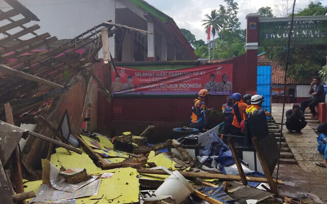 Rescuers inspect a school damaged by an earthquake in Cianjur, West Java, Indonesia, Nov. 21, 2022. (BASARNAS via AP) Rescuers inspect a school damaged by an earthquake in Cianjur, West Java, Indonesia, Nov. 21, 2022. (BASARNAS via AP)
