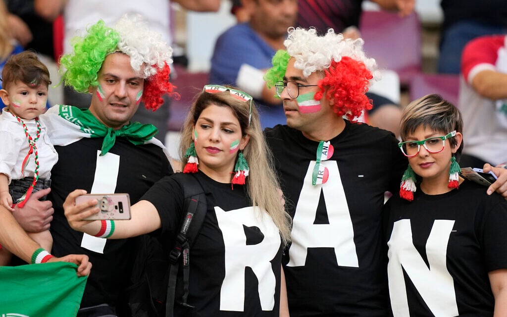 Illustrative: Iranian soccer fans pose for a selfie prior to the World Cup group B soccer match between England and Iran at the Khalifa International Stadium in Doha, Qatar, Monday, Nov. 21, 2022. (AP Photo/Frank Augstein) Illustrative: Iranian soccer fans pose for a selfie prior to the World Cup group B soccer match between England and Iran at the Khalifa International Stadium in Doha, Qatar, Monday, Nov. 21, 2022. (AP Photo/Frank Augstein)