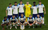 England players pose for a group photo prior to the start of the World Cup group B soccer match between England and Iran at the Khalifa International Stadium in Doha, Qatar, November 21, 2022. (Pavel Golovkin/AP)