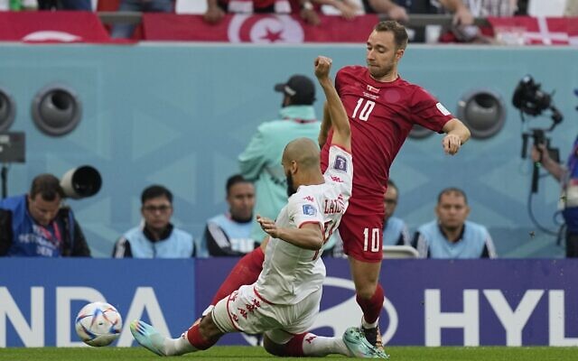 Tunisia's Aissa Laidouni, foreground, tries to stop Denmark's Christian Eriksen during the World Cup group D soccer match between Denmark and Tunisia, at the Education City Stadium in Al Rayyan, Qatar, Tuesday, Nov. 22, 2022. (AP Photo/Ariel Schalit) Tunisia's Aissa Laidouni, foreground, tries to stop Denmark's Christian Eriksen during the World Cup group D soccer match between Denmark and Tunisia, at the Education City Stadium in Al Rayyan, Qatar, Tuesday, Nov. 22, 2022. (AP Photo/Ariel Schalit)