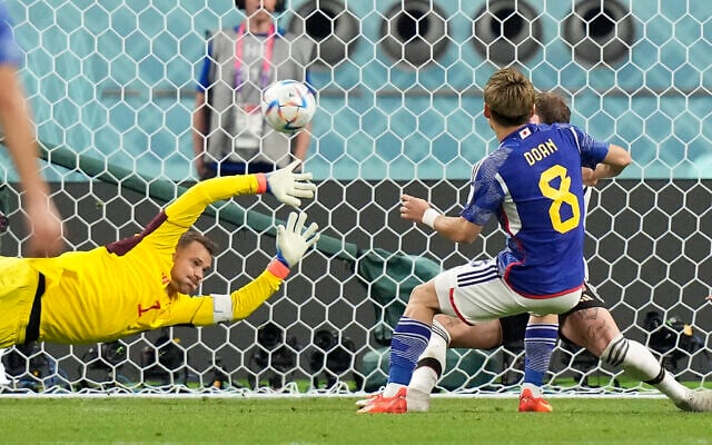 Japan's Ritsu Doan scores his side's first goal against Germany's goalkeeper Manuel Neuer, left, during the World Cup match between Germany and Japan, at the Khalifa International Stadium in Doha, Qatar, November 23, 2022. (AP Photo/Matthias Schrader) Japan's Ritsu Doan scores his side's first goal against Germany's goalkeeper Manuel Neuer, left, during the World Cup match between Germany and Japan, at the Khalifa International Stadium in Doha, Qatar, November 23, 2022. (AP Photo/Matthias Schrader)