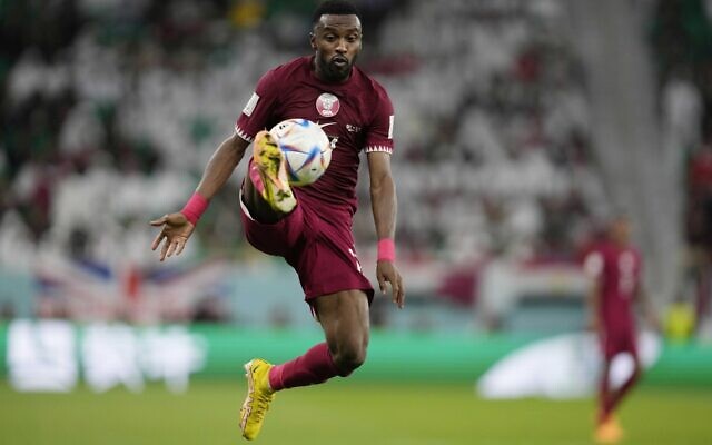 Qatar's Ismail Mohamad controls the ball during the World Cup group A soccer match between Qatar and Senegal, at the Al Thumama Stadium in Doha, Qatar, Friday, Nov. 25, 2022. (AP/Thanassis Stavrakis)