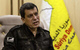 Mazloum Abdi, the commander of the US-backed Syrian Democratic Forces, speaks during a news conference in Hassakeh, Syria, Saturday, Nov. 26, 2022.  (AP Photo/Baderkhan Ahmad)