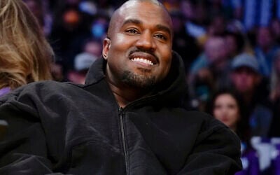 Kanye West watches the first half of an NBA basketball game between the Washington Wizards and the Los Angeles Lakers in Los Angeles, on March 11, 2022. (AP/Ashley Landis)