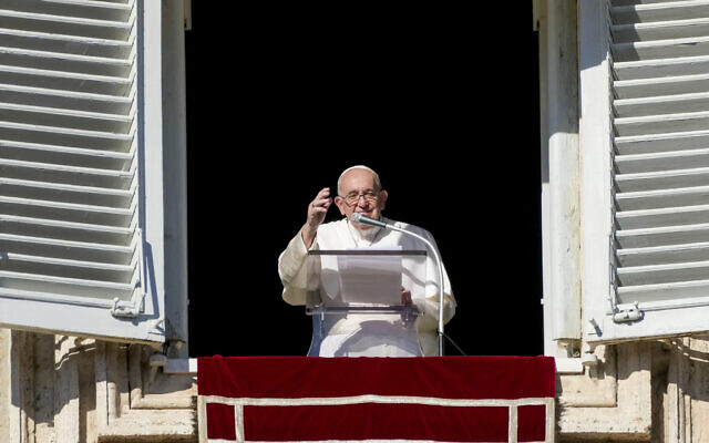 Pope Francis delivers his blessing as he recites the Angelus noon prayer from the window of his studio overlooking St.Peter's Square, at the Vatican, Sunday, Nov. 27, 2022. (AP/Andrew Medichini)