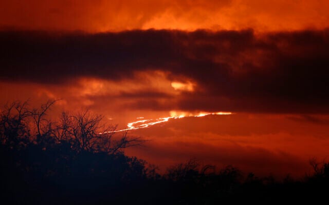 A river of lava flows down from Mauna Loa, Monday, Nov. 28, 2022, near Hilo, Hawaii. Mauna Loa, the world's largest active volcano erupted Monday for the first time in 38 years. (AP Photo/Marco Garcia) A river of lava flows down from Mauna Loa, Monday, Nov. 28, 2022, near Hilo, Hawaii. Mauna Loa, the world's largest active volcano erupted Monday for the first time in 38 years. (AP Photo/Marco Garcia)