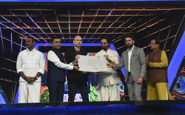 Israeli filmmaker and jury chair Nadav Lapid, third left, being honored by Indian ministers at the closing ceremony of the International Film Festival of India in Goa, India, Nov.28, 2022. (Press Information Bureau via AP) Israeli filmmaker and jury chair Nadav Lapid, third left, being honored by Indian ministers at the closing ceremony of the International Film Festival of India in Goa, India, Nov.28, 2022. (Press Information Bureau via AP)
