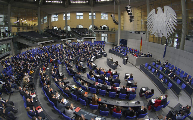 Illustrative: German Chancellor Olaf Scholz delivers a speech during a meeting of the German federal parliament, Bundestag, at the Reichstag building in Berlin, Germany, Dec. 15, 2021. (AP Photo/Michael Sohn) Illustrative: German Chancellor Olaf Scholz delivers a speech during a meeting of the German federal parliament, Bundestag, at the Reichstag building in Berlin, Germany, Dec. 15, 2021. (AP Photo/Michael Sohn)