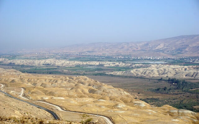 View of the Jordan Valley from a military post near the West Bank settlement of Hemdat. The Jordanian villages of al-Balawinah and Kuraymah are seen in the distance, November 28. 2022. (Emanuel Fabian/Times of Israel) View of the Jordan Valley from a military post near the West Bank settlement of Hemdat. The Jordanian villages of al-Balawinah and Kuraymah are seen in the distance, November 28. 2022. (Emanuel Fabian/Times of Israel)