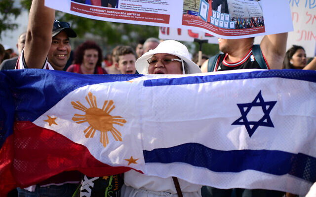 Illustrative: Filipino workers, their children and activists take part in a protest against deportation in Tel Aviv, June 24, 2019. (Tomer Neuberg/Flash90) Illustrative: Filipino workers, their children and activists take part in a protest against deportation in Tel Aviv, June 24, 2019. (Tomer Neuberg/Flash90)