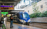 Passengers at Ben Gurion train station near Tel Aviv on October 28, 2021. (Yossi Aloni/Flash90)