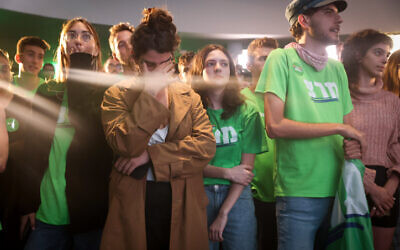 Meretz party supporters react as the results of the Israeli elections are announced, in Jerusalem November 1, 2022. (Flash90) Meretz party supporters react as the results of the Israeli elections are announced, in Jerusalem November 1, 2022. (Flash90)