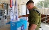 IDF soldier votes at the Sa'ar military base in central Golan Heights on November 1, 2022 (Michael Giladi/Flash90)