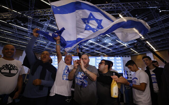 Likud party supporters celebrate at the party headquarters on election night, November 1, 2022. (Olivier Fitoussi/Flash90)