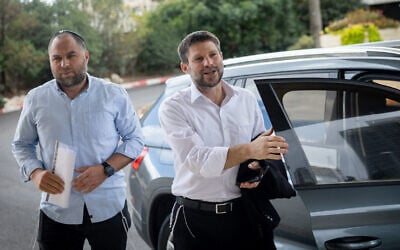 Religious Zionist party head MK Bezalel Smotrich (right) arrives for coalition talks at a hotel in Jerusalem, November 9, 2022. (Yonatan Sindel/Flash90) Religious Zionist party head MK Bezalel Smotrich (right) arrives for coalition talks at a hotel in Jerusalem, November 9, 2022. (Yonatan Sindel/Flash90)