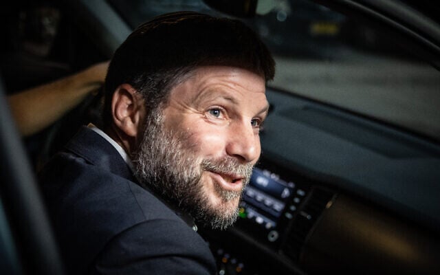 Religious Zionism party head MK Bezalel Smotrich exits a coalition negotiation meeting with Shas party head Aryeh Deri in Jerusalem on November 13, 2022. (Yonatan Sindel/Flash90)