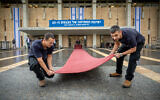 Workers seen preparing for Tuesday's opening session of the Knesset, in Jerusalem on November 14, 2022 (Yonatan Sindel/Flash90)