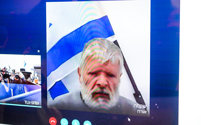 Ya'akov Ben Avraham, accused of murdering his wife a few weeks ago in Herzliya, seen on a screen via a video link during a court hearing at the Tel Aviv District Court, on November 30, 2022. (Avshalom Sassoni/Flash90) Ya'akov Ben Avraham, accused of murdering his wife a few weeks ago in Herzliya, seen on a screen via a video link during a court hearing at the Tel Aviv District Court, on November 30, 2022. (Avshalom Sassoni/Flash90)