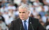 Outgoing Prime Minister Yair Lapid addresses IDF cadets graduating from the military's officer's course at Bahad 1 in southern Israel, November 10, 2022. (Amos Ben Gershom/GPO)
