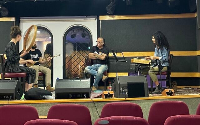 Iranian-born wind musician Amir Shahar, middle, in rehearsal ahead of the Oud Festival, November 3-12, 2022 at Jerusalem's Confederation House (Jessica Steinberg/Times of Israel) Iranian-born wind musician Amir Shahar, middle, in rehearsal ahead of the Oud Festival, November 3-12, 2022 at Jerusalem's Confederation House (Jessica Steinberg/Times of Israel)