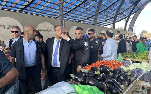 Religious Zionism MK Itamar Ben Gvir on a campaign stop in Sderot's open market on election day, November 1, 2022. (Jacob Magid/Times of Israel)