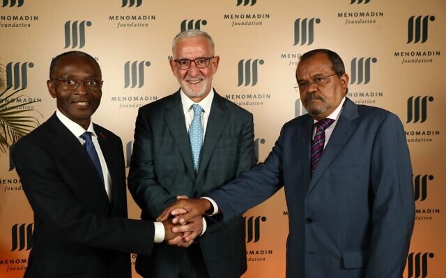 Angolan Ambassador to Israel Osvaldo dos Santos Varela (right), president and founder of the Menomadin Foundation Haim Taib (center) and former Angola vice president Bornito de Sousa Baltazar Diogo (left) in Tel Aviv on November 13, 2022. (Sivan Farag)