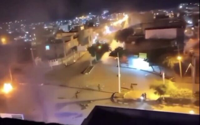 Screen capture from video purporting to show the moments when shots were fired at a market in the city of Izeh, Iran, November 16, 2022. (Twitter. Used in accordance with Clause 27a of the Copyright Law) Screen capture from video purporting to show the moments when shots were fired at a market in the city of Izeh, Iran, November 16, 2022. (Twitter. Used in accordance with Clause 27a of the Copyright Law)