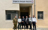 (L-R) Lt. Col. Yedidya Atlas, chief of special projects for the IDF Rabbinate; Col. Avner Cohen, Chief of Staff of the IDF Rabbinate; Rabbi Elie Estrin, Aleph Military Liaison; Chaplain (Captain) Elisar Admon, US Army Reserve; Rabbi Yonatan Rubin, Director of Casualty Affairs for the IDF; and Cmdr. Ofir Tubul, Chief Rabbi of the Israeli Navy, outside the IDF Chief Rabbinate offices in Tel Aviv, September 2022. (Courtesy)