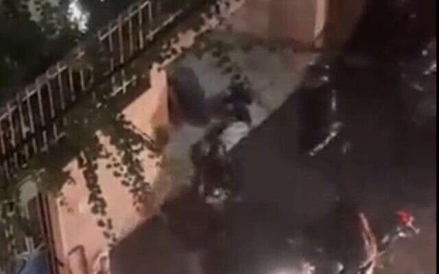 Screen capture from video purportedly showing Iranian police beating and shooting a prone protester in Tehran, October 1, 2022. (Twitter. Used in accordance with Clause 27a of the Copyright Law) Screen capture from video purportedly showing Iranian police beating and shooting a prone protester in Tehran, October 1, 2022. (Twitter. Used in accordance with Clause 27a of the Copyright Law)