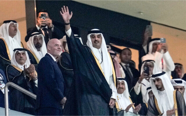 Emir of Qatar Tamim bin Hamad Al Thani waves to the crowd beside FIFA President Giovanni Infantino, left, prior the World Cup group A soccer match between Qatar and Ecuador at the Al Bayt Stadium in Al Khor, November 20, 2022. (AP Photo/Natacha Pisarenko) Emir of Qatar Tamim bin Hamad Al Thani waves to the crowd beside FIFA President Giovanni Infantino, left, prior the World Cup group A soccer match between Qatar and Ecuador at the Al Bayt Stadium in Al Khor, November 20, 2022. (AP Photo/Natacha Pisarenko)