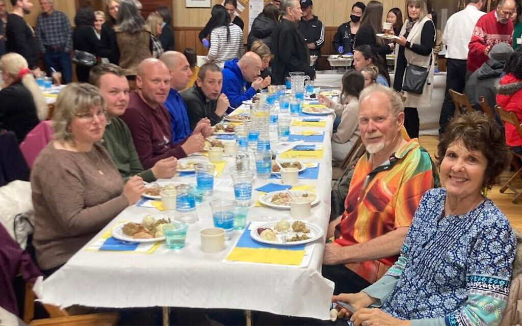 Ukrainian evacuees celebrate a pre-Thanksgiving meal at the Ukrainian American Civic Center in Buffalo, New York. (Courtesy of Jewish Federations of North America via JTA) Ukrainian evacuees celebrate a pre-Thanksgiving meal at the Ukrainian American Civic Center in Buffalo, New York. (Courtesy of Jewish Federations of North America via JTA)
