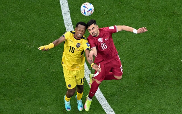 Ecuador's midfielder Romario Ibarra, left, fights for the ball with Qatar's defender Bassam Al Rawi during the Qatar 2022 World Cup Group A football match between Qatar and Ecuador at the Al-Bayt Stadium in Al Khor, north of Doha on November 20, 2022. (Kirill Kudryavtsev/AFP) Ecuador's midfielder Romario Ibarra, left, fights for the ball with Qatar's defender Bassam Al Rawi during the Qatar 2022 World Cup Group A football match between Qatar and Ecuador at the Al-Bayt Stadium in Al Khor, north of Doha on November 20, 2022. (Kirill Kudryavtsev/AFP)