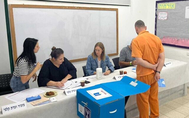 An incarcerated man votes Israel's general elections at a prison, on November 1, 2022. (Israel Prison Service) An incarcerated man votes Israel's general elections at a prison, on November 1, 2022. (Israel Prison Service)